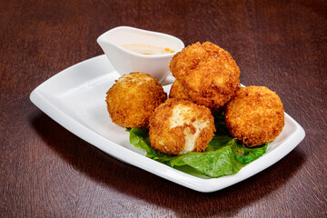 Fried cheese balls with sauce