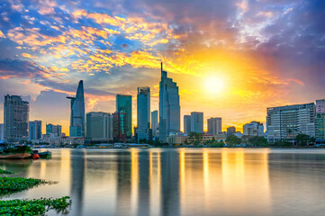 Riverside urban area at sunset sky after a period of social distancing because of the pandemic has revived in Ho Chi Minh City, Vietnam