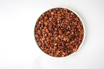 Crispy granola or muesli with chocolate isolated on white background