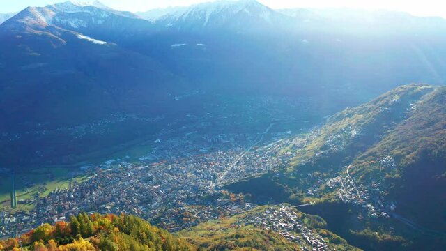 Aerial 4K, Valtellina, Italy, view of the city of Sondrio from the Carnale area
