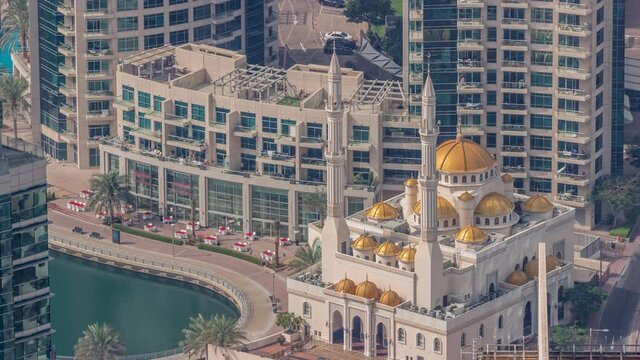 Aerial view of the small mosque of Dubai Marina at morning timelapse