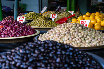 Green, black, red and white fresh olives in Moroccan market
