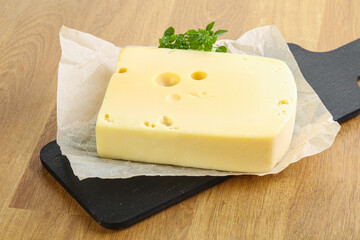 Maasdam cheese over the board