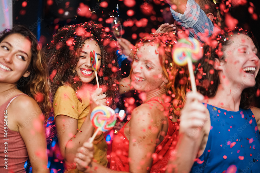 Canvas Prints Young multiracial friends having fun dancing together at 2022 new year's eve party night - Focus on african girl face