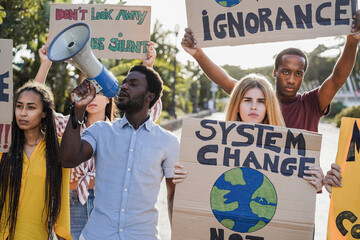 Young group of demonstrators on road from different culture and race protest for climate change -...