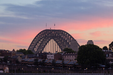 Sydney Harbour Bridge view with sunrise sky.