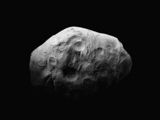 Asteroid isolated on a black background. Rocky surface of a large asteroid with craters. 