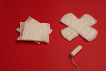 pads tampons underwear feminine hygiene red background