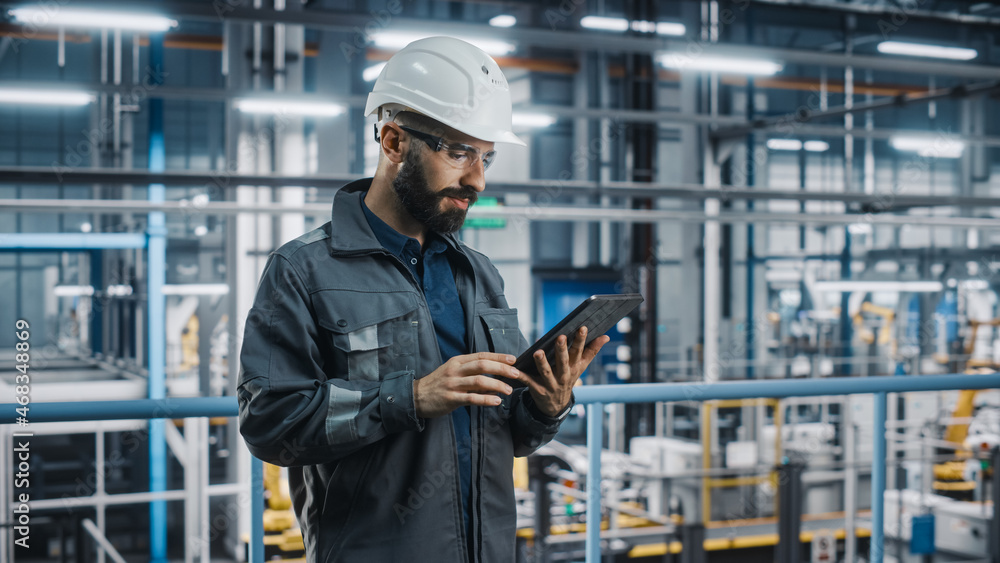 Aufkleber car factory engineer in work uniform using tablet computer. automotive industry 4.0 manufacturing fa