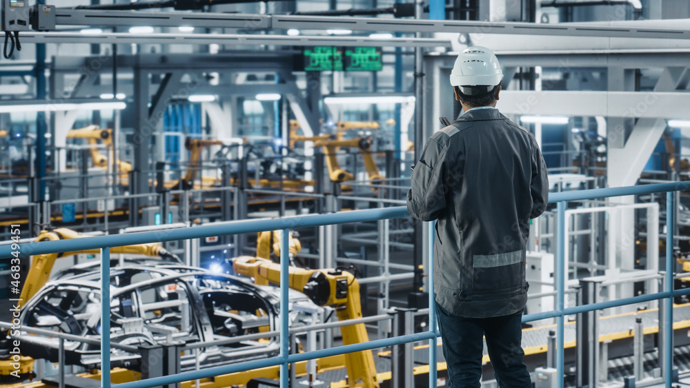Aufkleber multiethnic car factory engineer in work uniform using tablet computer. automotive industrial manufa