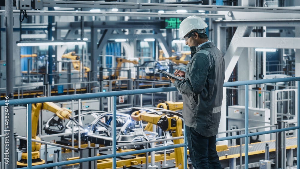 Aufkleber multiethnic car factory engineer in work uniform using tablet computer. automotive industrial manufa