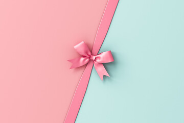 Pink and green pastel color background with pink ribbon bow minimal conceptual 3D rendering
