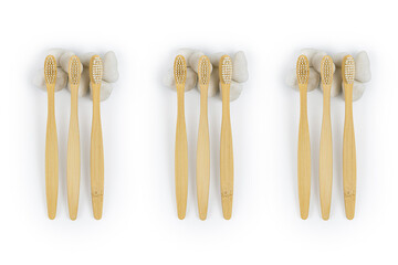 Bamboo toothbrushes on white stone. Health and hygiene concept. Top view