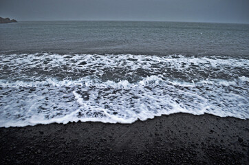 black beach and waves on a cloudy day, Lóndrangar, Iceland