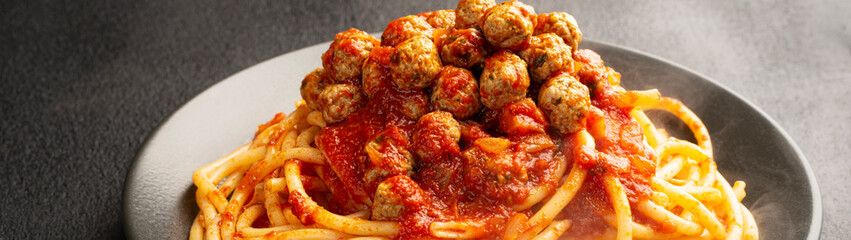 Close up plate SPAGHETTI MEATBALLS Like an Italian banner panoramic