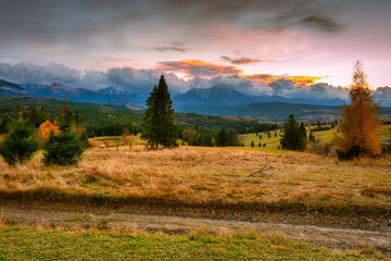 A colorful sunset over the autumnal Tatra Mountains. The pass over Lapszanka in Poland.