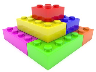 The pyramid is built of colored toy bricks