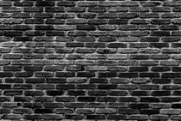 Black textured brick wall background.