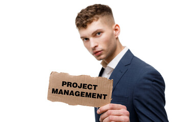 A businessman shows an inscription: PROJECT MANAGEMENT