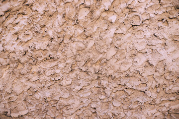 Beige cement texture wall background. Close up.
