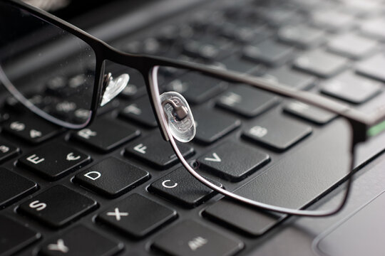 Clear Reading Glasses, Black Rim, On A Laptop Keypad, No People