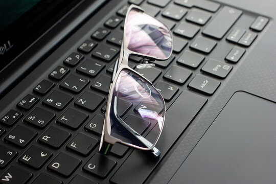 Clear Reading Glasses, Black Rim, On A Laptop Keypad, No People