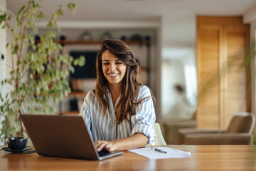 Dilligent caucasian woman, busily working, at home