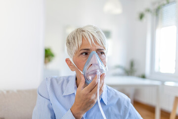Sick elderly woman on oxygen mask inhalation, pneumonia coronavirus pandemic. ill senior woman...