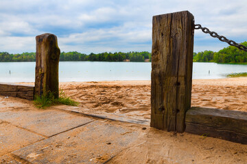 wooden poles at a lake in holland