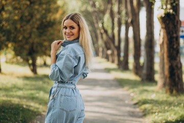 Young woman in denim jumpsuit