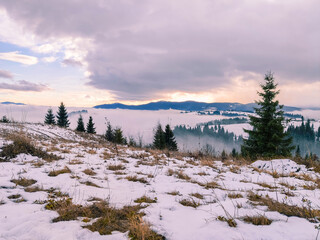 view of sunrise above snowed winter carpathian mountains