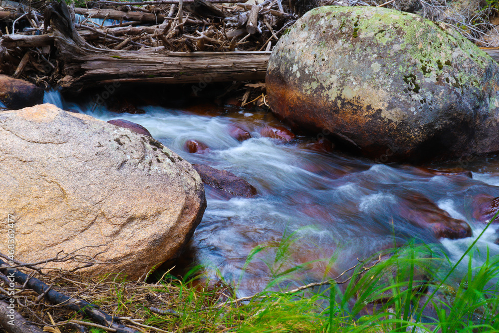 Sticker Closeup shot of a rocky river flowing downstream in Colorado, USA