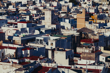 rooftops of the buildings of a city on a sunny day

