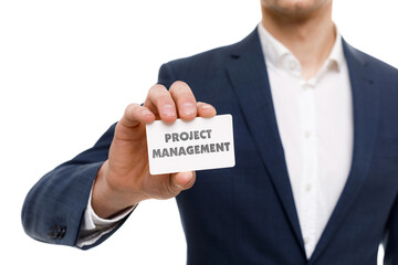 A businessman shows an inscription: PROJECT MANAGEMENT