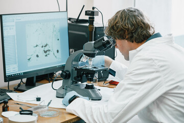 Scientist examines cannabis sativa mold through an electron microscope