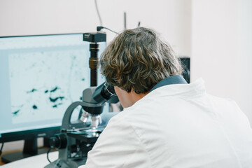 Scientist examines cannabis sativa mold through an electron microscope