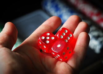 red playing dice, poker plastic chips, close-up, macrophotography, selective focus, blurry background, risk concept, stock exchange game, casino, gambling, gambling, excitement