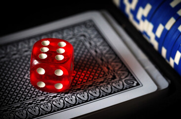 red playing dice, poker plastic chips, close-up, macrophotography, selective focus, blurry background, risk concept, stock exchange game, casino, gambling, gambling, excitement