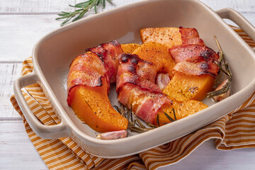 Baked pumpkin wrapped bacon. Thanksgiving pumpkin. Healthy food.