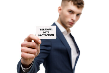 A businessman shows an inscription: PERSONAL DATA PROTECTION