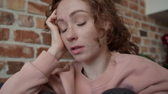Close up video of young sad caucasian woman using mobile phone. Shot with RED helium camera in 8K.