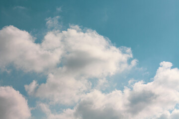 Blue peaceful Sky with fluffy clouds wallpaper. Idea for backdrop design