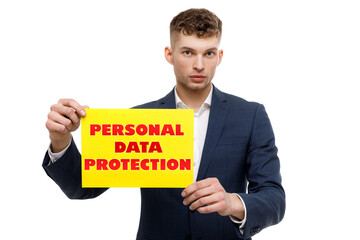 A businessman shows an inscription: PERSONAL DATA PROTECTION