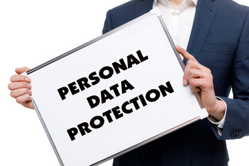 A businessman shows an inscription: PERSONAL DATA PROTECTION
