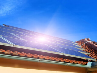 solar panels on house  roof, forest for background , electricity ecology renewable energy