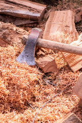 Fototapeta premium Woodcutting equipment, saw dust and logs