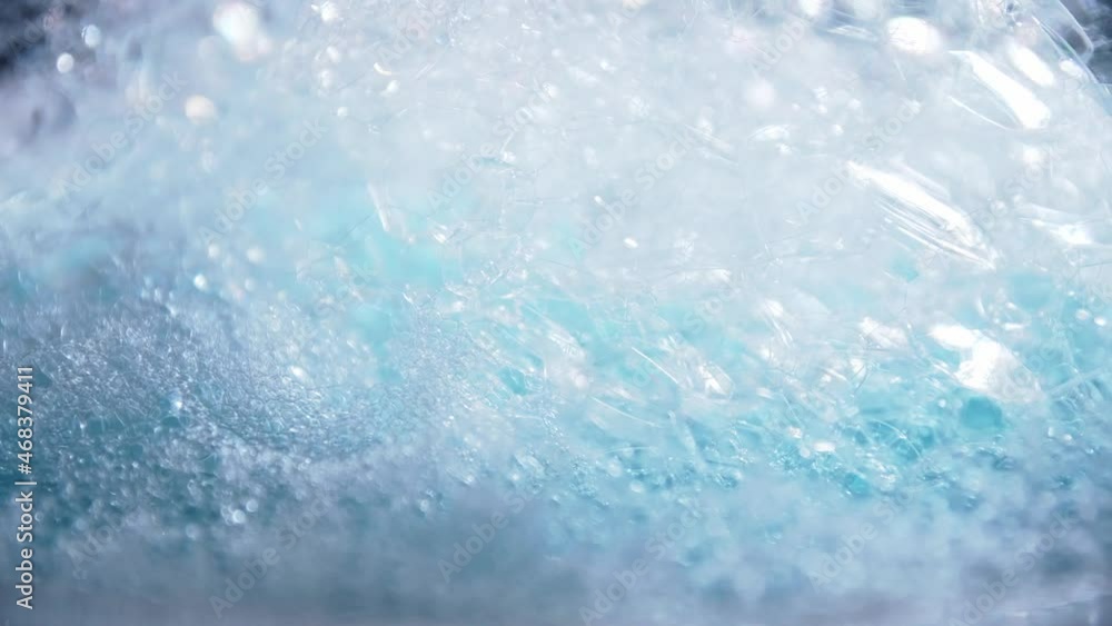 Poster blue color bubbles macro in rotating for background and design.