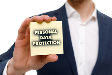 A businessman shows an inscription: PERSONAL DATA PROTECTION