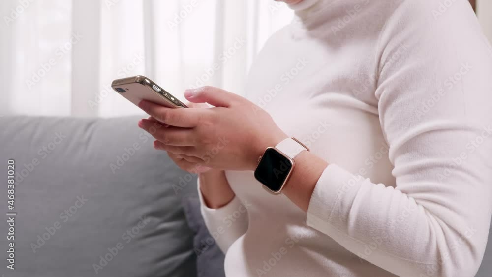Aufkleber detail of female hands checking notifications on cell phone. concept of internet of things and netwo