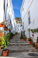 Fototapeta na wymiar Frigiliana, beautiful alley with stairs. Malaga, Andalusia, Spain
